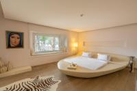 A bed or beds in a room at Casa dell'Arte Hotel of Arts & Leisure