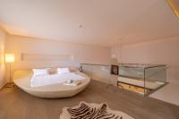 A bed or beds in a room at Casa dell'Arte Hotel of Arts & Leisure