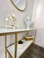 a shelf with a bird cage and a mirror at ENDLESS BLUE Dream Villa in Paleo Tsifliki