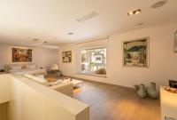 A television and/or entertainment centre at Casa dell'Arte Hotel of Arts & Leisure