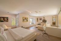 A bed or beds in a room at Casa dell'Arte Hotel of Arts & Leisure