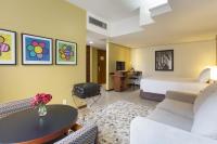 a hotel room with a bed and a table at Black Stream Hotel in Ribeirão Preto