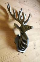 a metal sculpture of a deer head on a table at HaKaJu Appartement 10 personnes à Val Cenis in Lanslebourg-Mont-Cenis