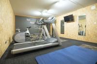 a room with a gym with a treadmill and a tv at HaKaJu Appartement 10 personnes à Val Cenis in Lanslebourg-Mont-Cenis