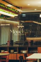 a restaurant with a sign on the wall at Estalagem Santa Iria Hotel & Spa in Tomar