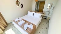 Postel nebo postele na pokoji v ubytování Thanos Hotel