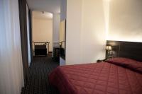 Posteľ alebo postele v izbe v ubytovaní Gemelli Hotel