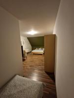 a small room with a bed and a bedroom at Guest house Wolf II in Plitvička Jezera