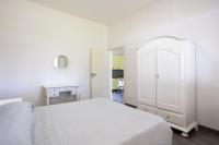 A bed or beds in a room at La Perla Di Mare - Gemma