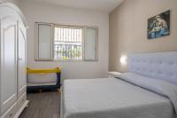 A bed or beds in a room at La Perla Di Mare - Gemma