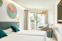 Łóżko lub łóżka w pokoju w obiekcie Iberostar Selection Albufera Playa All Inclusive