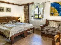 Posteľ alebo postele v izbe v ubytovaní Etno Garden Exclusive Rooms