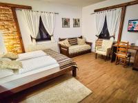 Posteľ alebo postele v izbe v ubytovaní Etno Garden Exclusive Rooms