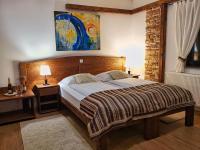 Posteľ alebo postele v izbe v ubytovaní Etno Garden Exclusive Rooms