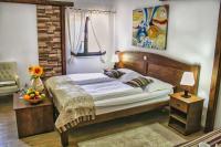 Posteľ alebo postele v izbe v ubytovaní Etno Garden Exclusive Rooms