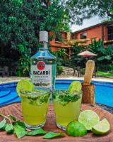a bottle of barapa next to two margaritas at Los Almendros de San Lorenzo in Suchitoto