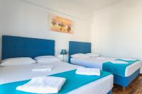 Postel nebo postele na pokoji v ubytování Super Paradise Apartments