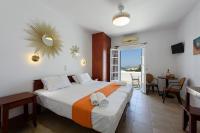 Posteľ alebo postele v izbe v ubytovaní Aigaiou Avra Apartments