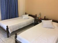 Postel nebo postele na pokoji v ubytování Evangelia House Sea View Apartments