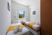 Posteľ alebo postele v izbe v ubytovaní Aigaiou Avra Apartments
