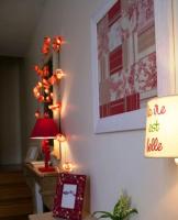 a living room with a christmas tree and a lamp at Gîte de la corgette in Saint-Romain