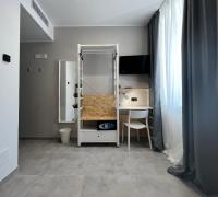 Posteľ alebo postele v izbe v ubytovaní Residence Hotel Moderno