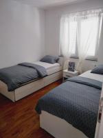 Posteľ alebo postele v izbe v ubytovaní Apartment KIM