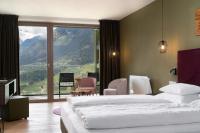 Posteľ alebo postele v izbe v ubytovaní Oliven- & Genusshotel Hirzer