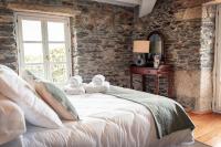 Postel nebo postele na pokoji v ubytování Villa Los Magnolios