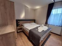 Postel nebo postele na pokoji v ubytování Residence Klažary u Žumberka