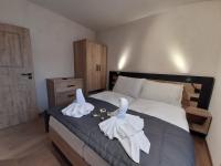 Postel nebo postele na pokoji v ubytování Residence Klažary u Žumberka