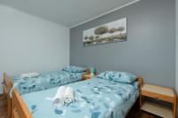 Łóżko lub łóżka w pokoju w obiekcie Holiday home Mali Vareski/Istrien 8734