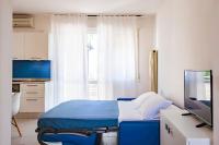 Posteľ alebo postele v izbe v ubytovaní Acquamarina Appartamenti