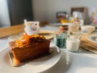 a piece of cake on a white plate on a table at La Casa in Saint-Brieuc