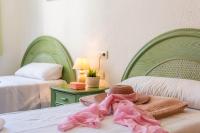 A bed or beds in a room at Apartamento Arenal 3 - PlusHolidays