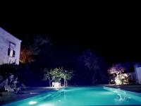 The swimming pool at or close to MASSERIA INCANTAMENTO Suite Bouganville