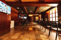 a dining room with chairs and a table and a bar at Town and Country Hotel V Mapa in Manila