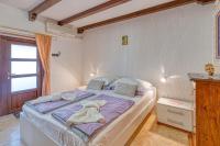 Posteľ alebo postele v izbe v ubytovaní Apartment Vilma Funtana