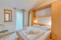 Posteľ alebo postele v izbe v ubytovaní Apartment Vilma Funtana