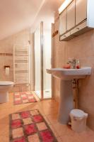 a bathroom with a sink and a toilet at La Maison de Mireille in Le Puy-en-Velay