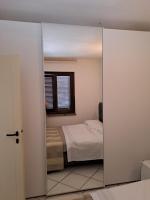 Posteľ alebo postele v izbe v ubytovaní Appartamenti Residence il Porto 13 e 16