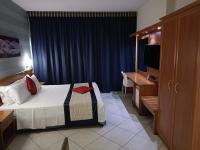 Posteľ alebo postele v izbe v ubytovaní Green Hotel Ninfa