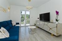 Televízia a/alebo spoločenská miestnosť v ubytovaní Luxury Apartment Veronika