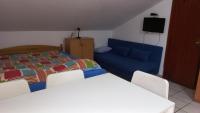 Posteľ alebo postele v izbe v ubytovaní Apartments Popov