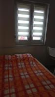 Posteľ alebo postele v izbe v ubytovaní Apartments Popov