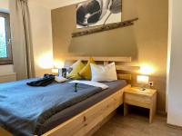 Posteľ alebo postele v izbe v ubytovaní Restaurant Appartements Almdiele