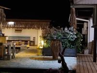 a patio with a bunch of flowers on it at Pension ANAPA LODGE - MOOREA in Vaianae