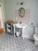 a bathroom with a white sink and a toilet at Cosy Billy - Appartement de charme in Billy