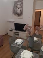 Televízia a/alebo spoločenská miestnosť v ubytovaní Apartman Vale