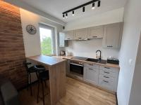 Kuchyňa alebo kuchynka v ubytovaní Nieborowska Loft - stylish apartment